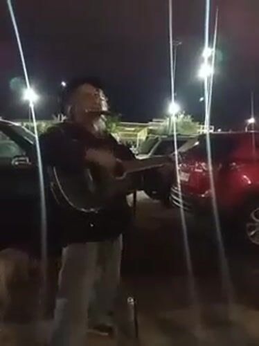Late-night acoustic set in an Arica parking lot