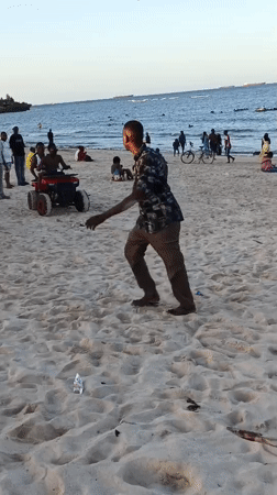 Busy afternoon beach scene captured in Dar es Salaam