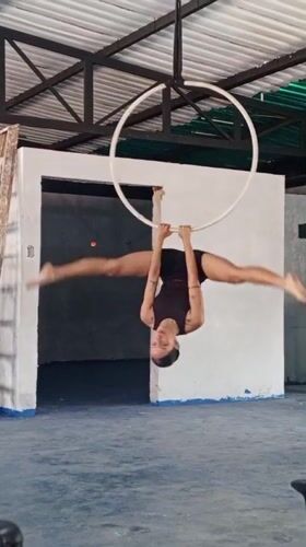Woman performs aerial hoop acrobatics in Porlamar, Venezuela