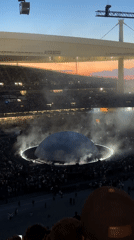 Stadium event features dome structure with lighting effects in Istanbul