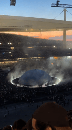 Stadium event features dome structure with lighting effects in Istanbul