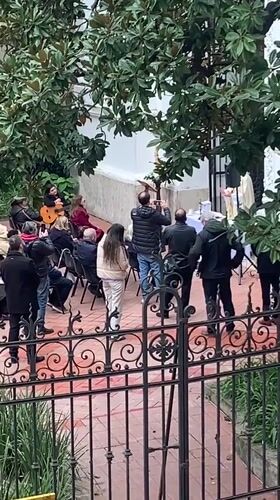 Small outdoor gathering draws dozens to Buenos Aires courtyard
