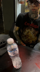 Tattooed individual spotted at Buenos Aires food court early morning