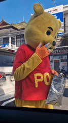 Person in Winnie the Pooh costume spotted on Kuta street