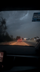Nighttime rainstorm affects highway traffic near Cholula, Mexico