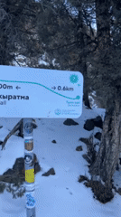 Winter hikers traverse frozen terrain in Kyrgyzstan mountains