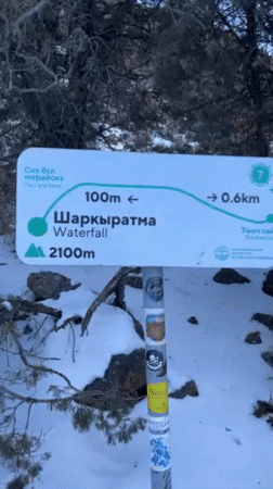 Winter hikers traverse frozen terrain in Kyrgyzstan mountains