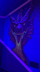 Dragon artwork with glowing elements displayed in Batumi room