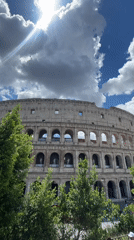 Tourist captures multiple angles of Colosseum on sunny morning