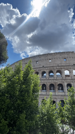 Tourist captures multiple angles of Colosseum on sunny morning