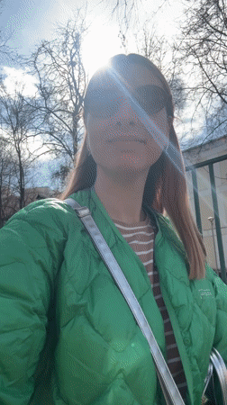 Woman records sunny day video with baby in Moscow