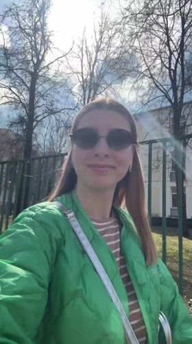 Woman records sunny day video with baby in Moscow
