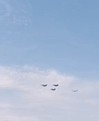 Military aircraft formation over Paris on Bastille Day