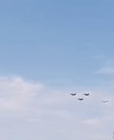 Military aircraft formation over Paris on Bastille Day