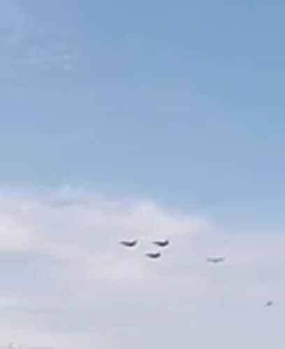 Military aircraft formation over Paris on Bastille Day