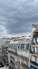 Rooftop panoramas across a cloudy Paris skyline