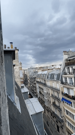 Rooftop panoramas across a cloudy Paris skyline