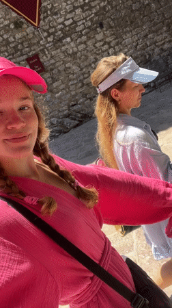 Tourists and street musicians enjoy morning in historic Budva