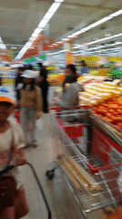 Busy morning shopping scene captured at Da Lat supermarket