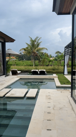 Woman enjoys luxury resort morning in Ubud, Indonesia