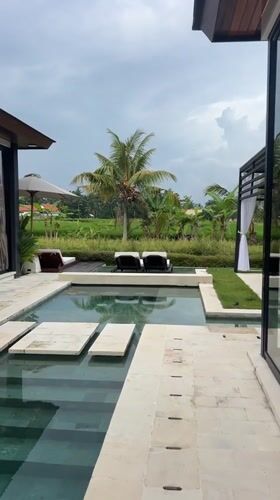 Woman enjoys luxury resort morning in Ubud, Indonesia