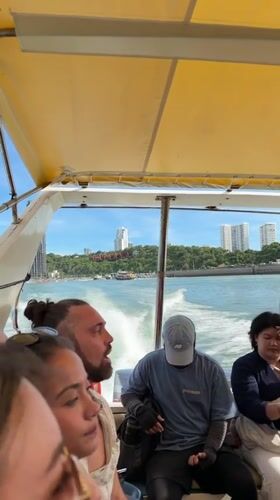 Group Takes Boat Trip on Sunny Day in Pattaya