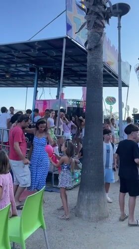 Beachside fair day: rides, carnival games, and outdoor karaoke