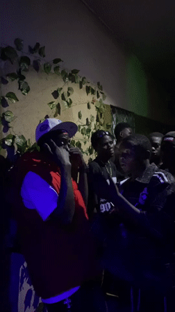 Young men gather for evening party in Nigerian community