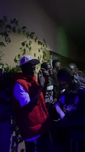Young men gather for evening party in Nigerian community