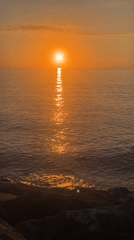Golden sunset over the Black Sea from Batumi's rocky shore