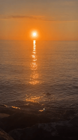 Golden sunset over the Black Sea from Batumi's rocky shore