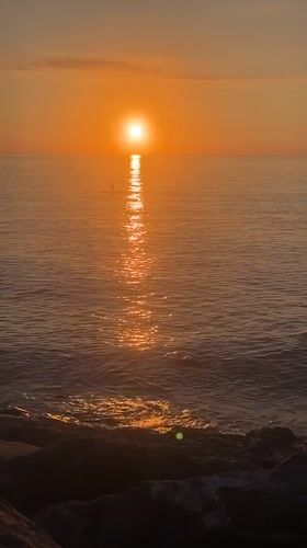 Golden sunset over the Black Sea from Batumi's rocky shore