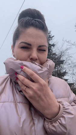 Woman photographed with car trouble in snowy Russian village