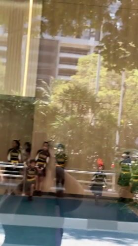 Youth cheerleading teams perform early morning mall routines in Kuala Lumpur