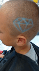 Geometric hair stencil detail at a Shumen barbershop