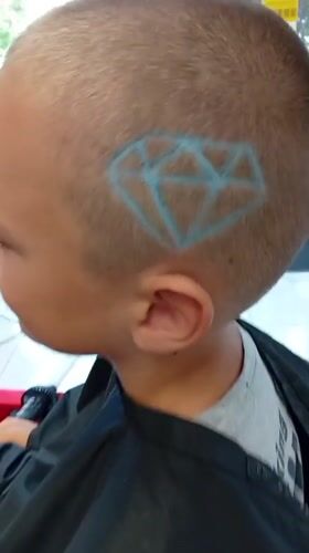 Geometric hair stencil detail at a Shumen barbershop