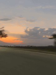 Rural landscape captured from moving vehicle near Tlaxcalancingo