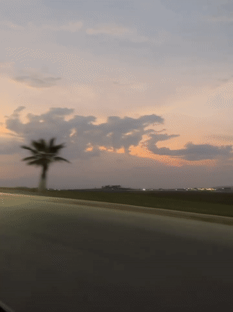 Rural landscape captured from moving vehicle near Tlaxcalancingo