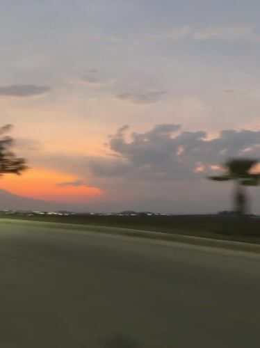 Rural landscape captured from moving vehicle near Tlaxcalancingo