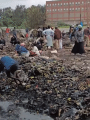 Fire aftermath and debris cleanup in a Nairobi neighborhood