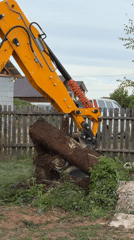 Excavator removes tree stumps in Chaikovsky residential construction zone