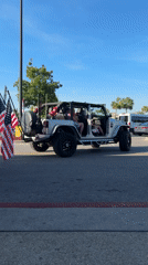 Flag-adorned Jeep spotted driving through Panama City Beach evening