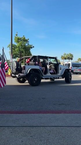 Flag-adorned Jeep spotted driving through Panama City Beach evening