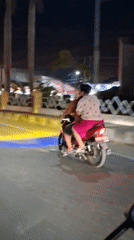 Couple spotted riding motorcycle in Lhokseumawe, Indonesia