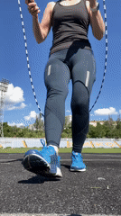Woman exercises with jump rope and soccer ball activities