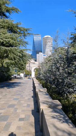 Afternoon street life across central Tbilisi's modern urban landscape