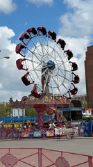 Carnival rides operating in Dmitrov, Russia on sunny day