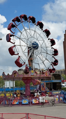 Carnival rides operating in Dmitrov, Russia on sunny day