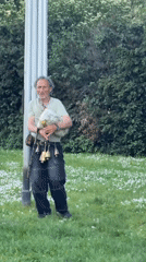Bagpiper performs outdoors in Sofia wearing traditional bells