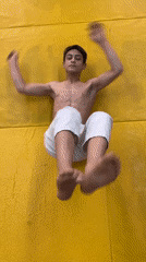 Young martial artist practices movements on mat in Krasnoyarsk